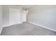 Clean bedroom with plush carpeting, white trim, and a closet with white bi-fold doors at 563 Viceroy Ct, Kissimmee, FL 34758