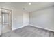 Neutral-toned bedroom featuring carpet, a closet and easy access to the hallway and other rooms at 563 Viceroy Ct, Kissimmee, FL 34758