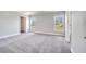 Spacious bedroom with plush carpeting, two windows and a walk-in closet at 563 Viceroy Ct, Kissimmee, FL 34758