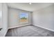 Bright bedroom with a large window offering natural light and a view of the outside at 563 Viceroy Ct, Kissimmee, FL 34758