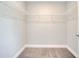 Empty walk-in closet with wall mounted racks at 563 Viceroy Ct, Kissimmee, FL 34758