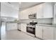 Modern kitchen with stainless steel appliances and white cabinetry at 563 Viceroy Ct, Kissimmee, FL 34758