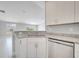 Open kitchen boasts granite countertops and stainless steel dishwasher at 563 Viceroy Ct, Kissimmee, FL 34758