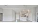 Spacious living room features recessed lights, neutral paint, and tile flooring at 563 Viceroy Ct, Kissimmee, FL 34758