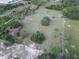 Extensive aerial perspective of a property with abundant land and greenery, showcasing the size and potential of the lot at 6100 Skokie Rd, Lake Wales, FL 33898