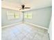 Sunny bedroom with tiled floor and large windows, creating a peaceful retreat at 6100 Skokie Rd, Lake Wales, FL 33898