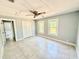 Bright bedroom with tile flooring, ceiling fan and closet at 6100 Skokie Rd, Lake Wales, FL 33898