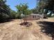 Charming home surrounded by lush trees and neat landscaping, offering a serene and private setting at 6100 Skokie Rd, Lake Wales, FL 33898