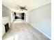Spacious living room featuring a ceiling fan and lots of natural light at 6100 Skokie Rd, Lake Wales, FL 33898