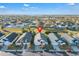Aerial view of a single-Gathering home showcasing well-manicured lawns and neighborhood at 620 Old Bridge Cir, Davenport, FL 33897