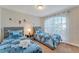 Bright bedroom featuring two twin beds, a nightstand, starry decal and sheer curtains at 620 Old Bridge Cir, Davenport, FL 33897