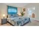 Cozy main bedroom with soft lighting, plush bedding, and access to the bathroom at 620 Old Bridge Cir, Davenport, FL 33897
