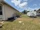 Expansive backyard with trailer parking, a fence line, and lush greenery at 6480 Fall St, St Cloud, FL 34771