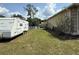 Leafy backyard offering lush greenery with space to park a camper trailer at 6480 Fall St, St Cloud, FL 34771