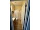Cozy bathroom with a vanity, toilet, and a shower behind a curtain at 6480 Fall St, St Cloud, FL 34771