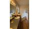 Bathroom featuring dual sinks, a corner tub, and a shower at 6480 Fall St, St Cloud, FL 34771
