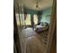 Inviting bedroom with natural light, complemented by wood floors and a ceiling fan at 6480 Fall St, St Cloud, FL 34771