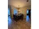 Cozy dining room with a chandelier and a view of the backyard at 6480 Fall St, St Cloud, FL 34771