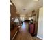 Inviting hallway with wood floors leading to the spacious living area at 6480 Fall St, St Cloud, FL 34771