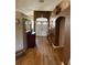 Entry hallway with beautiful wood floors, decorated walls, and high ceilings at 6480 Fall St, St Cloud, FL 34771
