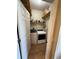 Functional laundry room with washer, dryer, shelving, and ample storage space at 6480 Fall St, St Cloud, FL 34771