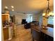 Bright living space featuring an open layout with a kitchen, dining, and living area at 6480 Fall St, St Cloud, FL 34771