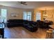 Spacious living room featuring a comfortable sectional sofa and wood floors at 6480 Fall St, St Cloud, FL 34771