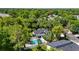 This aerial view showcases a private pool and a well-maintained yard surrounded by lush greenery at 650 Main St, Altamonte Springs, FL 32701