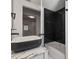 Stylish bathroom featuring modern fixtures, marble countertops and flooring, and a bathtub at 650 Main St, Altamonte Springs, FL 32701