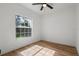 This bedroom features hardwood floors, neutral paint and a window providing lots of natural light at 650 Main St, Altamonte Springs, FL 32701
