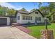 Charming two-story home with lush landscaping and a two car garage with wooden porch at 650 Main St, Altamonte Springs, FL 32701