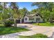 Charming two-story home with lush landscaping, mature trees, and a two car garage at 650 Main St, Altamonte Springs, FL 32701