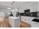 Modern kitchen with white cabinets, stainless steel appliances, and marble countertops at 650 Main St, Altamonte Springs, FL 32701