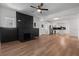 Open concept living room featuring updated kitchen with a large island and a modern fireplace at 650 Main St, Altamonte Springs, FL 32701
