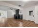 Open-concept living room featuring new floors, white walls, a sleek fireplace, and natural light at 650 Main St, Altamonte Springs, FL 32701