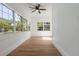 Bright living room featuring hardwood floors, neutral paint and large windows providing lots of natural light at 650 Main St, Altamonte Springs, FL 32701