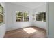 Bright living room featuring hardwood floors, neutral paint and large windows providing lots of natural light at 650 Main St, Altamonte Springs, FL 32701