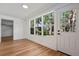 Bright living room featuring hardwood floors, neutral paint and large windows providing lots of natural light at 650 Main St, Altamonte Springs, FL 32701