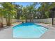 Enjoy this in-ground pool surrounded by mature trees in a private backyard oasis at 650 Main St, Altamonte Springs, FL 32701