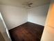 Bedroom features hardwood floors, a ceiling fan, and good natural light at 709 Orchid Dr, Davenport, FL 33897