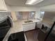 Kitchen features granite countertops, stainless steel appliances, and new cabinets at 709 Orchid Dr, Davenport, FL 33897