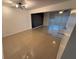 Living room showcases tile floors, a brick accent wall and natural light from sliding glass doors at 709 Orchid Dr, Davenport, FL 33897