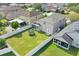 View of a well-maintained backyard with green grass and white fence at 721 Hardwood Cir, Orlando, FL 32828