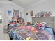 Bedroom with neutral walls and floors and a bed featuring a comforter with race car designs on it at 721 Hardwood Cir, Orlando, FL 32828
