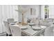 Elegant dining area featuring stylish seating and modern lighting at 721 Hardwood Cir, Orlando, FL 32828