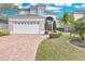 Charming two-story home with a well-manicured lawn and welcoming curb appeal at 721 Hardwood Cir, Orlando, FL 32828