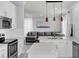 Open-concept kitchen with an island, flowing seamlessly into the living area at 721 Hardwood Cir, Orlando, FL 32828