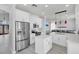 Modern kitchen boasting white cabinetry, stainless steel appliances, and a center island at 721 Hardwood Cir, Orlando, FL 32828