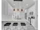 Stylish kitchen featuring white cabinets, modern lighting, and stainless steel appliances at 721 Hardwood Cir, Orlando, FL 32828