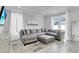 Spacious living room featuring a large sectional sofa and bright natural light at 721 Hardwood Cir, Orlando, FL 32828
